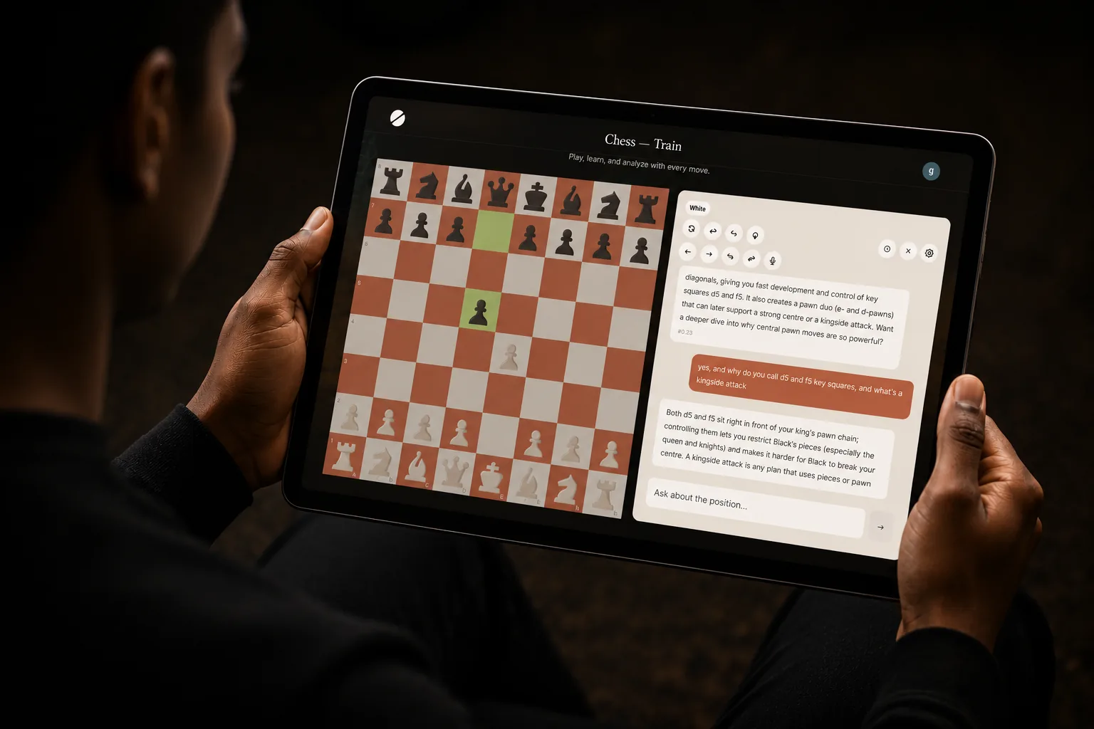 Child using the e4 AI chess coach on a tablet